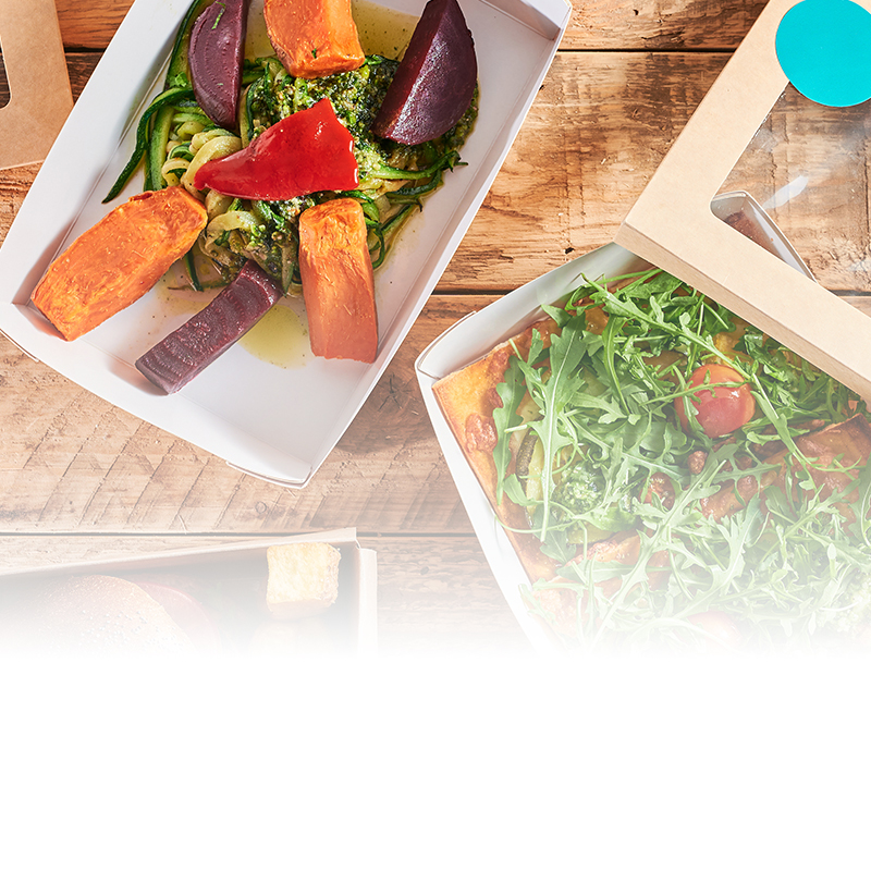  Mittagessen mit Burger, Pinsa, Salat und Gemüse als Symbol für den Mittagessen-Zuschuss bei Siewert & Kau Technologies. 